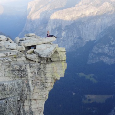 Sitting on the top of diving board. Top of Half Dome